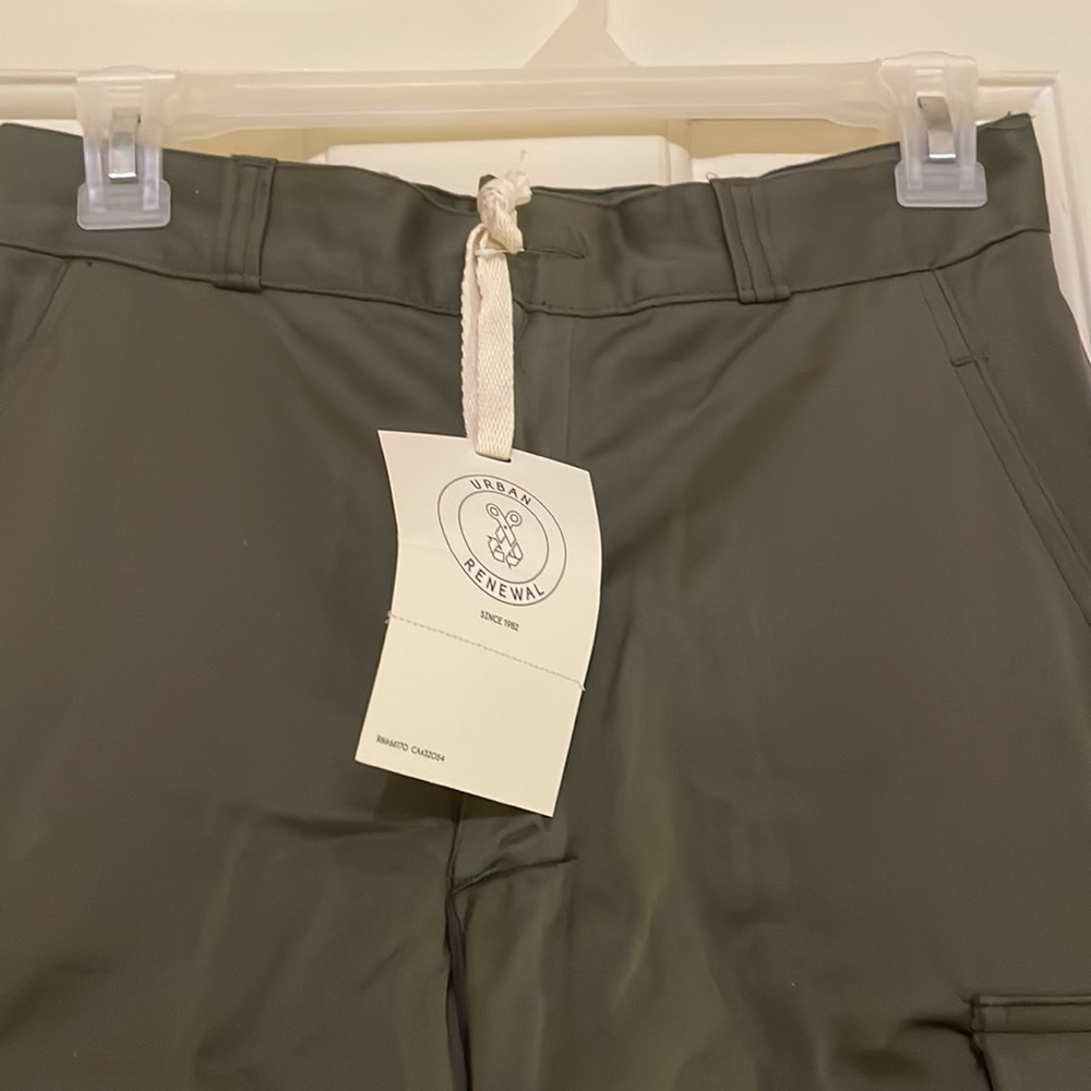 COPY - Cargo or military green pants. Size large but fits like a small in my op…